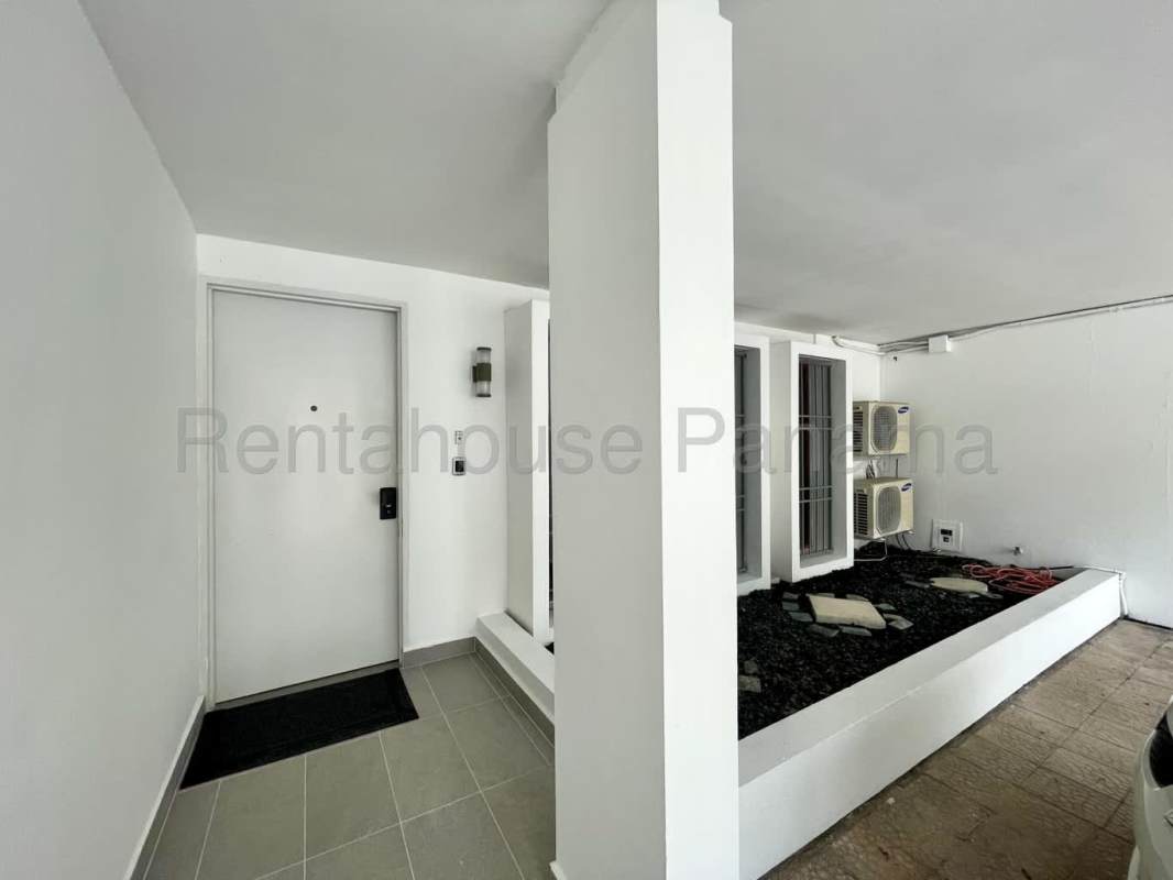 Spacious balcony terrace overlooking private garden Obarrio house rental Panama City