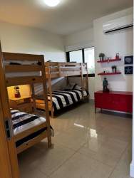Kitchen with appliances including refrigerator, oven, microwave, washer dryer at Casamar Resort Panama
