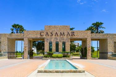 Coastal style master bedroom with en-suite bathroom and ocean balcony view Casamar Resort Panama