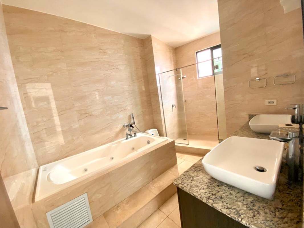 Modern bedroom with city and ocean views large windows PH Punta Paitilla Panama furnished rental