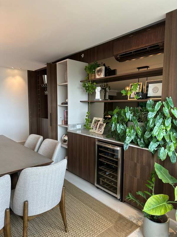 Dining room with cabinetry, built-in fridge, and wood features PH Bali Costa del Este
