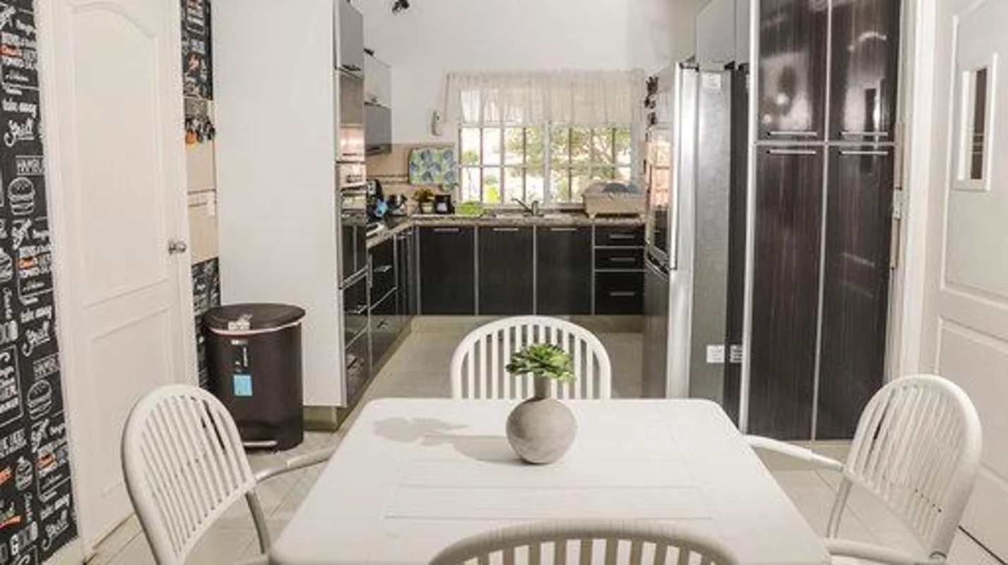 Modern master bedroom with balcony, large windows Fuente del Fresno Panama