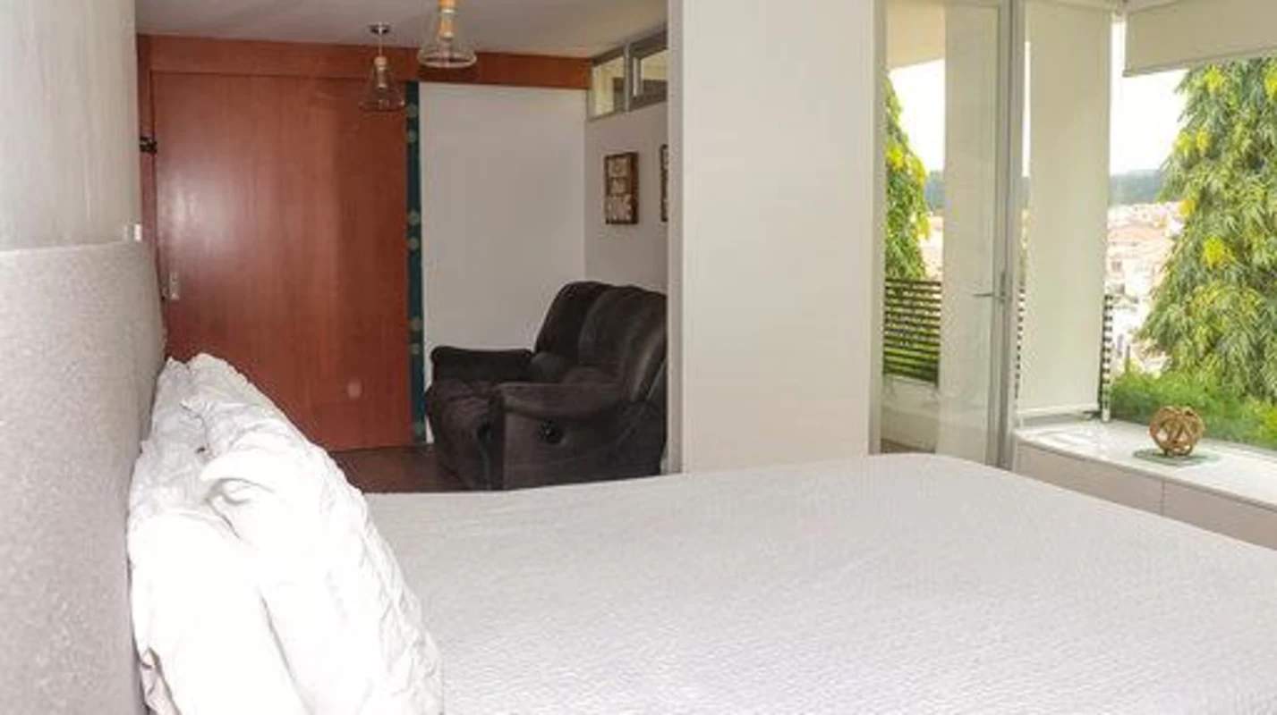 Open plan living area with large windows and access to terrace Fuente del Fresno Panama