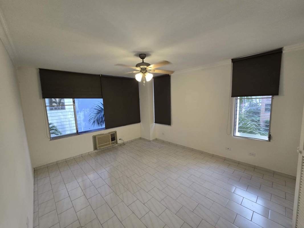 Living room with ceiling fans, air conditioning, ceramic tile floors in PH Ocean View apartment for rent Panama