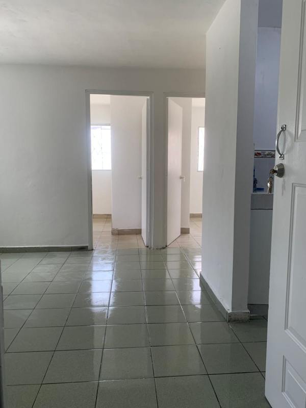 Minimalist hallway leading to bedrooms living area apartment Tocumen Panama