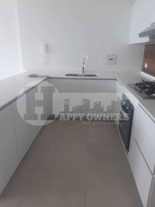 Bright living room with large windows and city skyline view in PH Van Gogh El Cangrejo