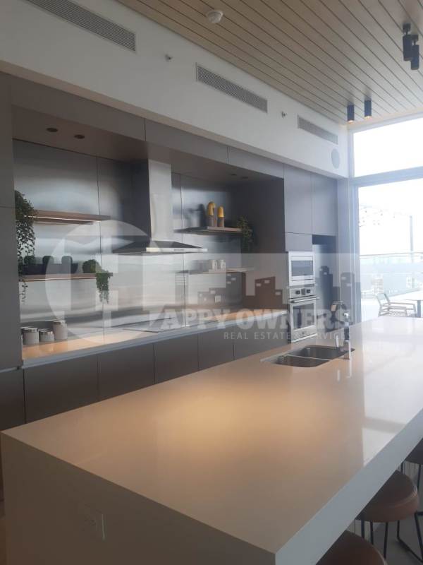 Rooftop terrace lounge area with panoramic city view and stylish design at PH Van Gogh