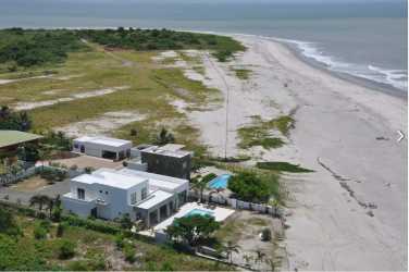 Aerial photo of beachfront villa with pool and large sandy beach at Punta Chame Panama