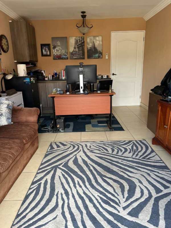 Spacious kitchen with granite counters, dark cabinets and breakfast nook at Paseo Dorado Dorado Lake house Panama