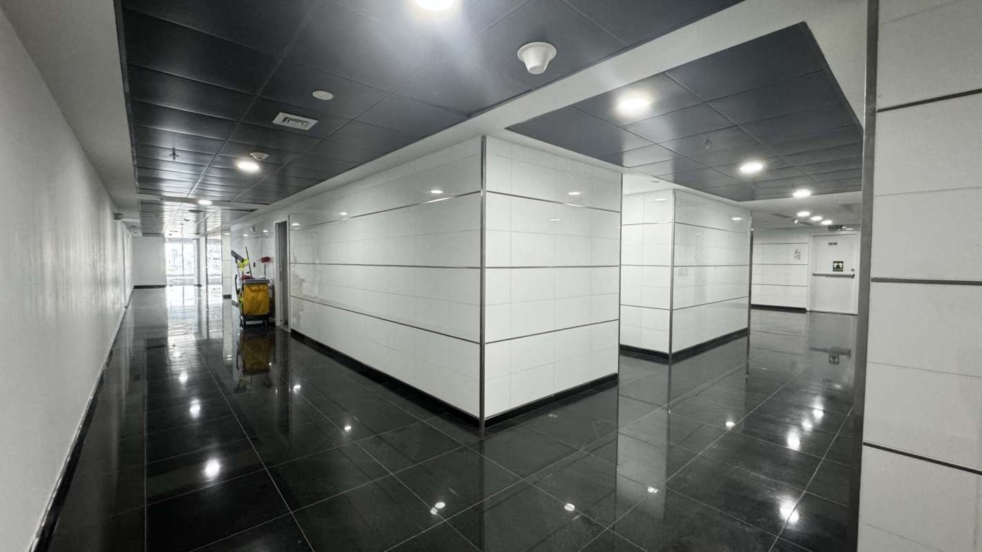 Contemporary conference room with glass door, display screen at Oceania Business Plaza