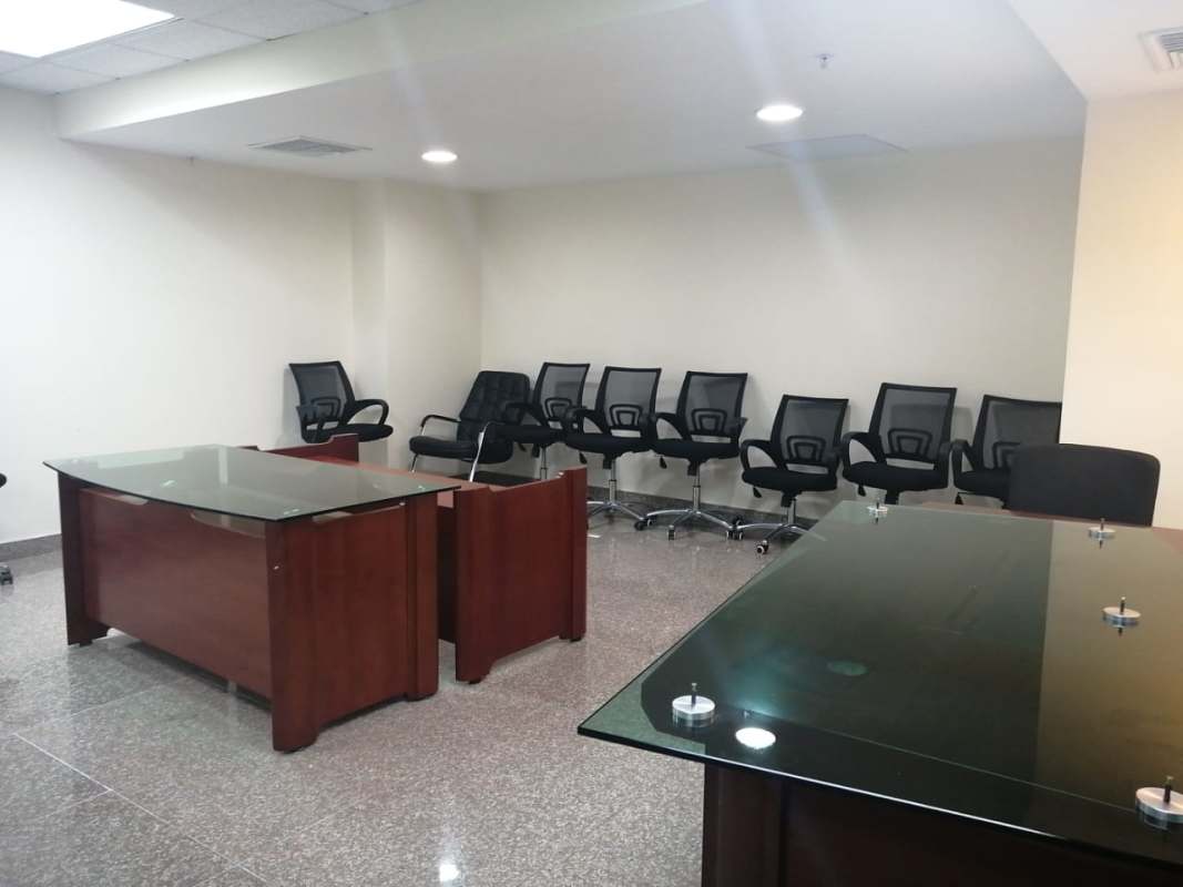 Tall glass skyscraper Costa del Este Financial Park along boulevard in Panama City