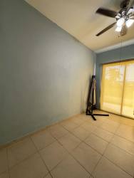 Bedroom with sliding doors and ceiling fan leads to outdoor terrace PH Playa Blanca Resort in Panama beach