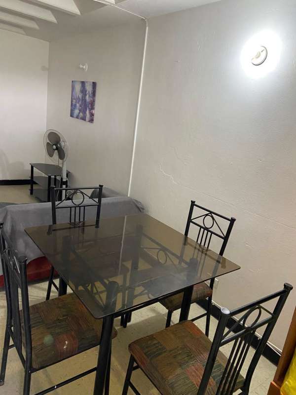 Compact living and dining room in Villa Gabriela apartment Río Abajo Panama, white walls, natural light