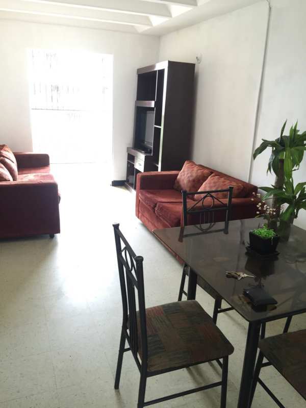 Bedroom with window, curtains, simple furnishings Villa Gabriela apartment Panama City