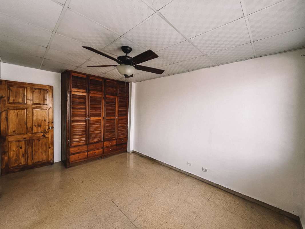 Bright living dining room connected to balcony with tile floors in PH Plaza España Panama City