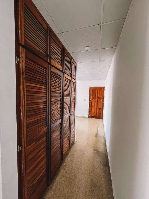 Main bedroom with built-in wardrobes ceiling fan and natural light in PH Plaza España