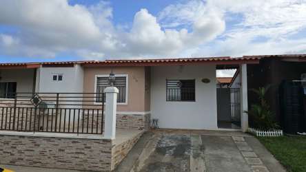 Street view fenced yard single-story house Las Magnolias Costa Verde Panama