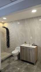 Modern bathroom walk-in shower gray tiles in Las Magnolias Costa Verde Panama