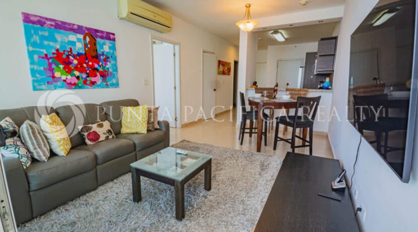 Modern bathroom with stone countertop and glass shower in PH Ocean Club Punta Pacifica Panama