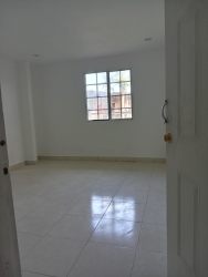 Simple bedroom with tile floor and window in Valle San Bernardino