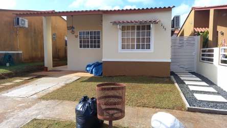 Compact kitchen with gas stove, propane tank, fridge in house for rent Playa Leona La Chorrera