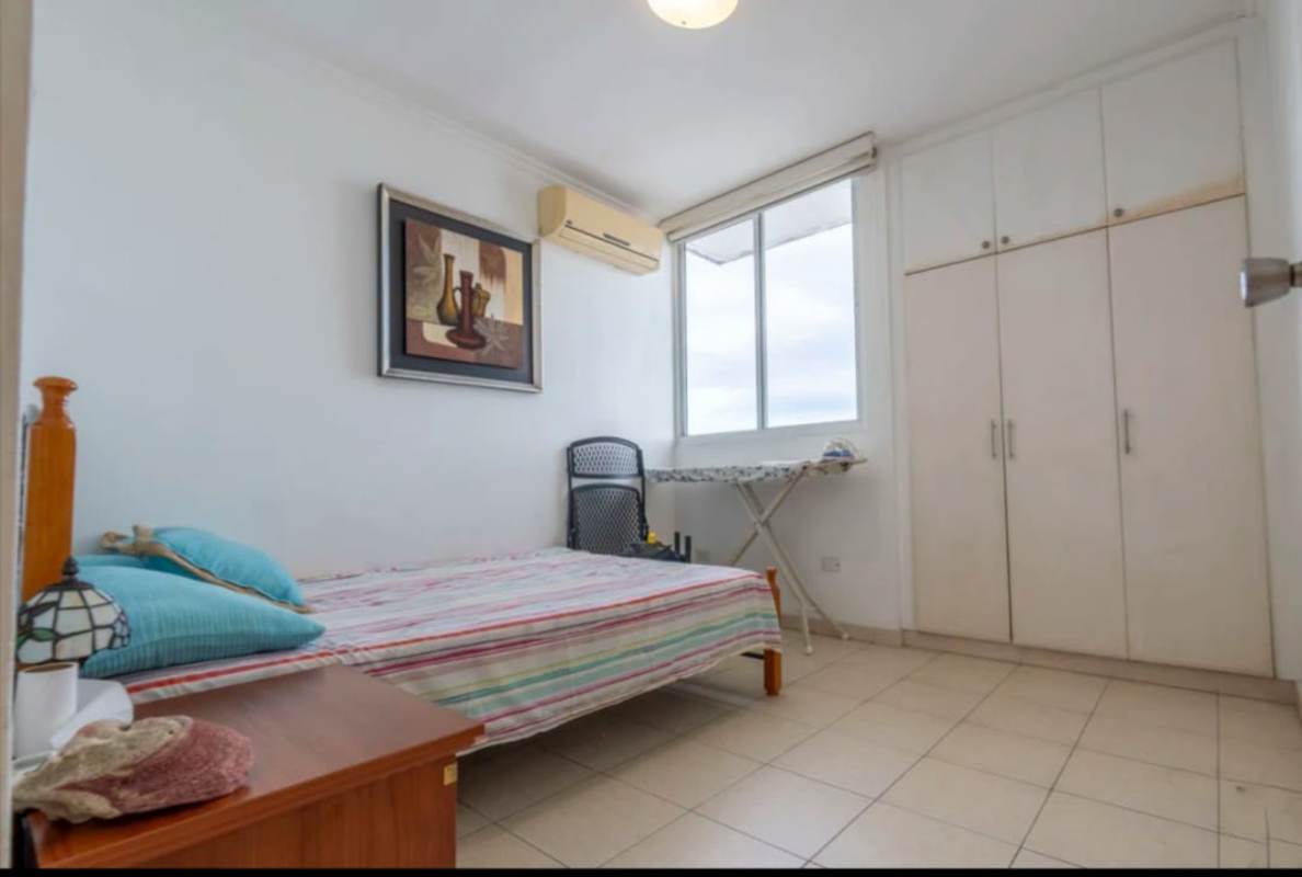 Bedroom with large window, AC unit, and built-in closet in PH Via Argentina Panama City