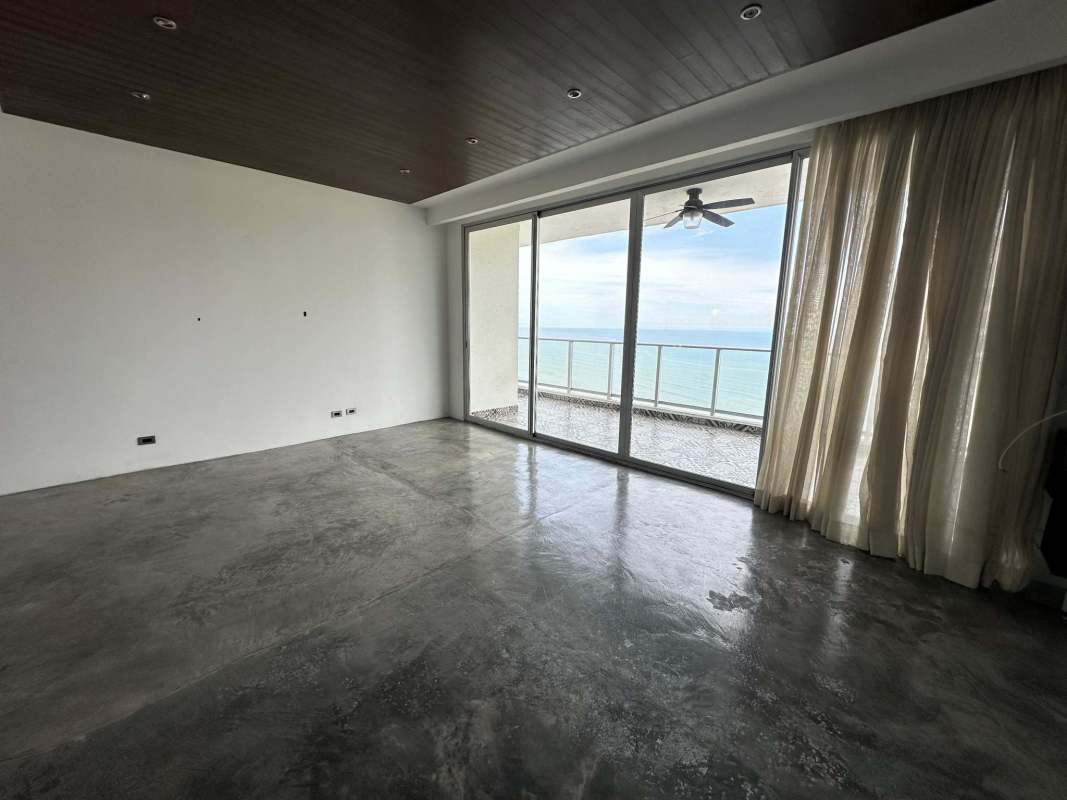 Living room with large floor-to-ceiling windows offering ocean view at PH Dupont Punta Pacifica