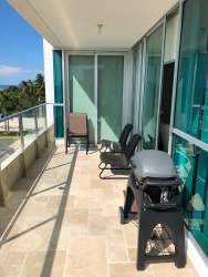 Contemporary open kitchen with breakfast bar in Lighthouse Playa Blanca Tower Condo Panama