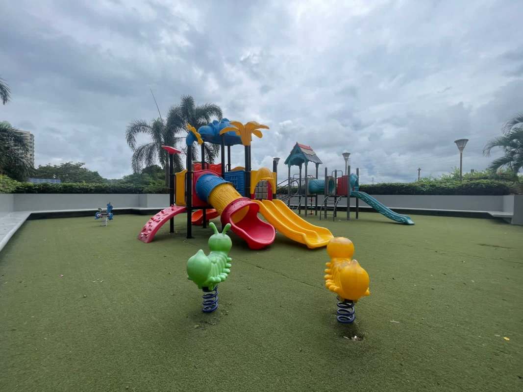 Bright living and dining room with sofa, TV, dining table at PH Rokas apartment Condado del Rey Panama City