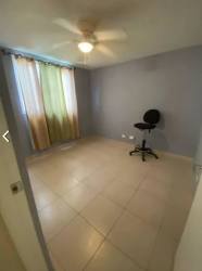 Remodeled kitchen with granite countertops, tile floors, window, stainless stove Playa Dorada Panama