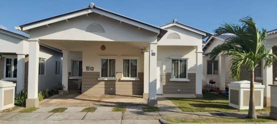 Open concept living and dining room with tile floors, windows, neutral decor in Playa Dorada Panama