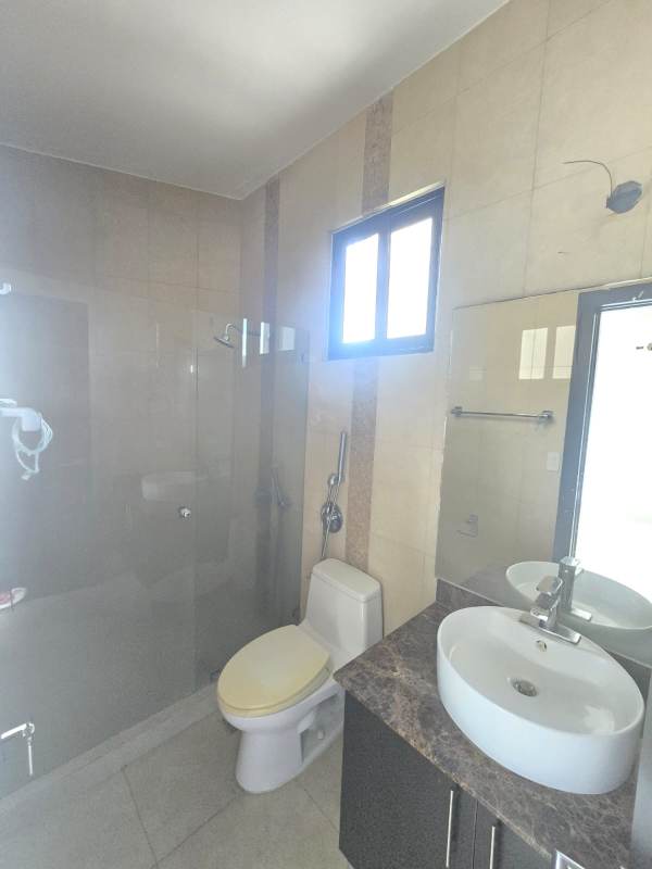 Contemporary kitchen with granite countertops and tile backsplash at Amador Heights Panama