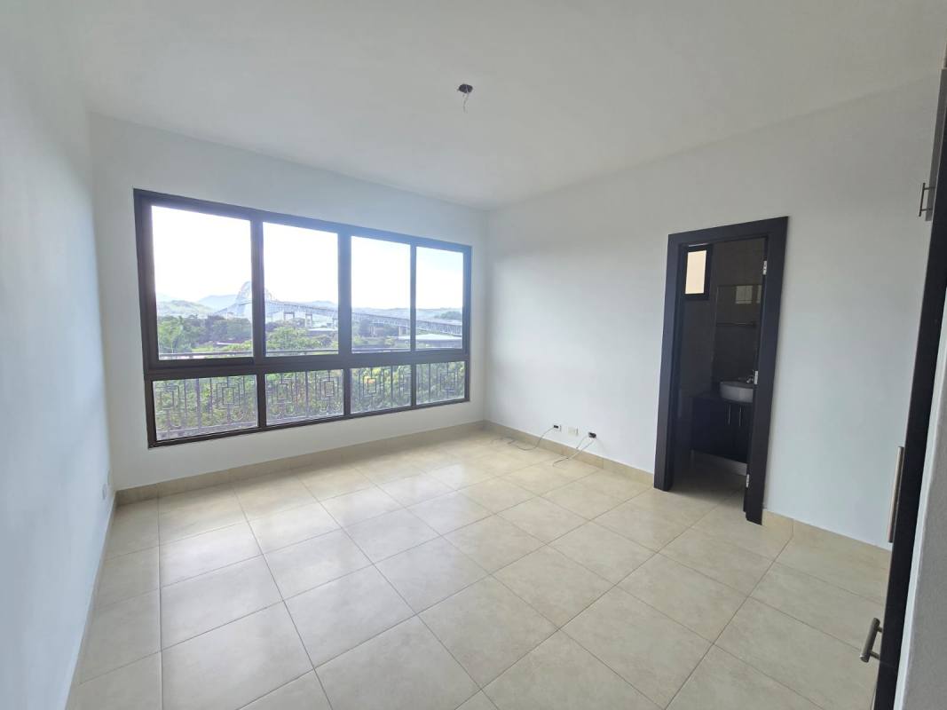 Bright second bedroom with large window and city mountain views in Amador Heights Panama