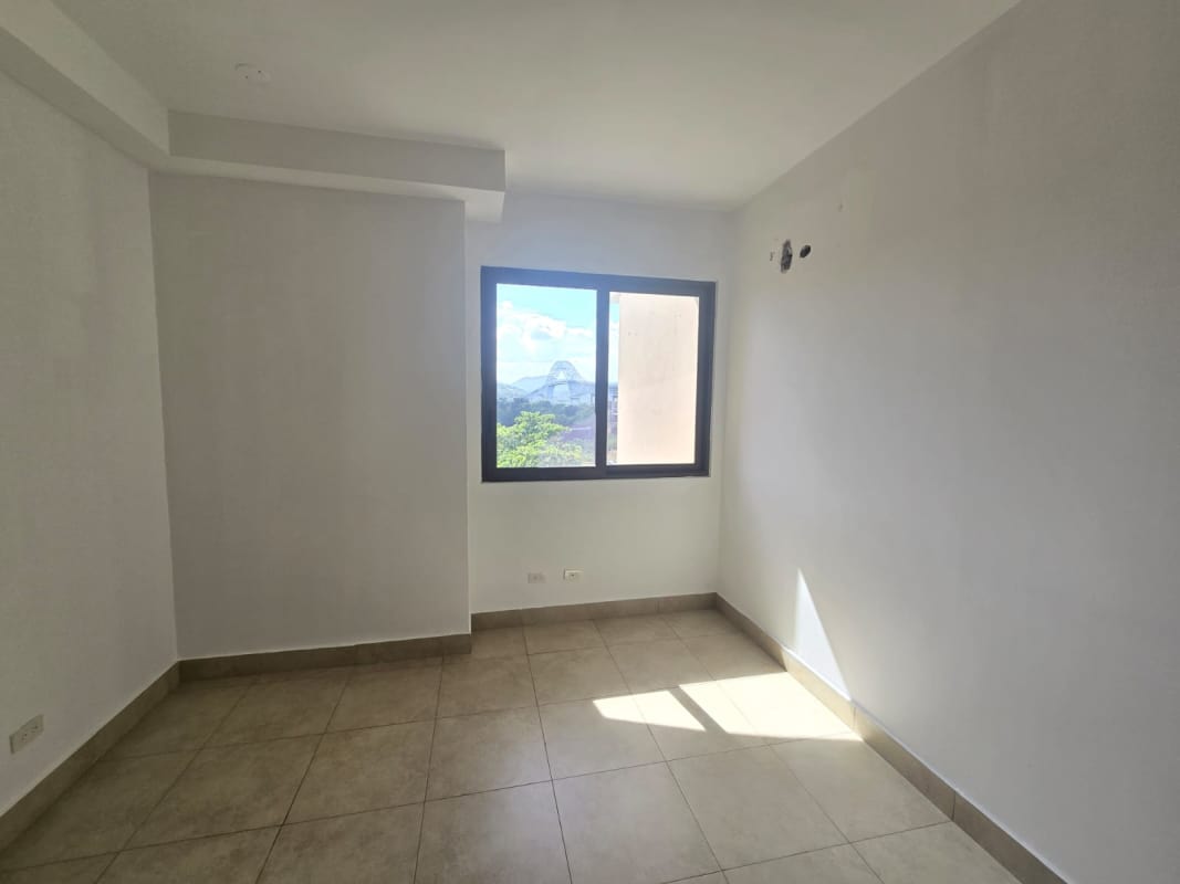 Open living dining room opening onto balcony with amazing ocean views at Amador Heights