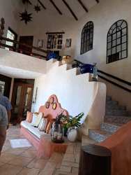 Generous living areas with vaulted ceilings in Punta Barco beachfront house