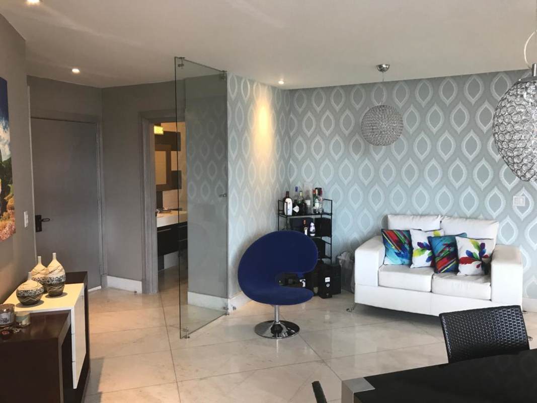 Spacious open living dining area with large windows and skyline view in PH Terrace