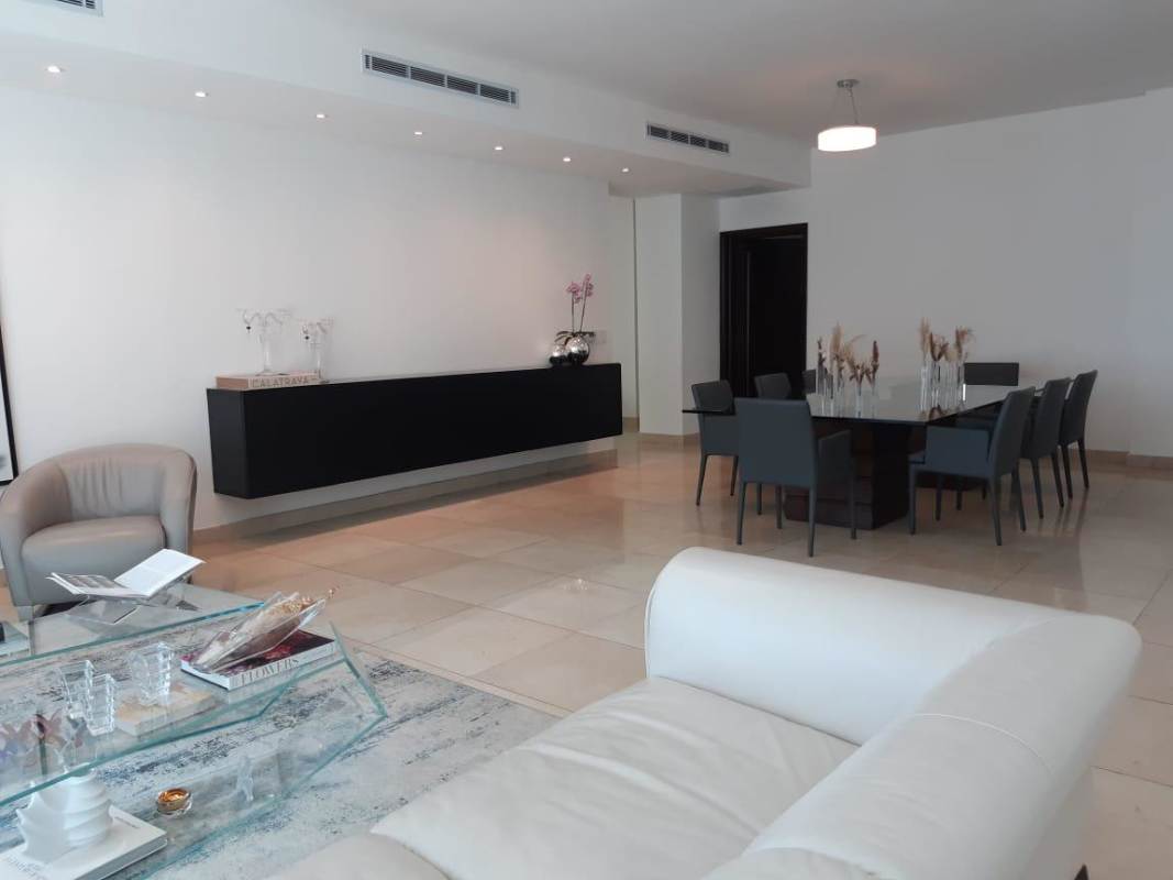 Spacious kitchen with granite counters island stainless appliances in PH Pacific Star Punta Paitilla Panama City