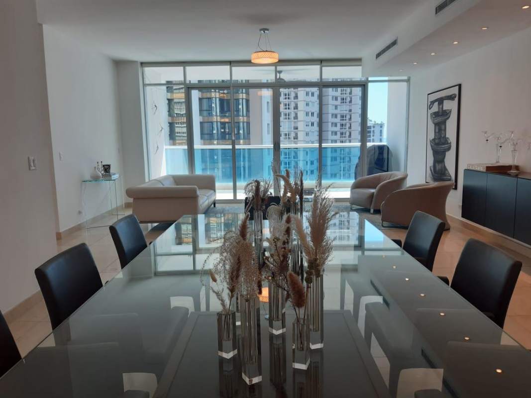 Private balcony with glass railing overlooking city skyline and ocean PH Pacific Star Punta Paitilla Panama