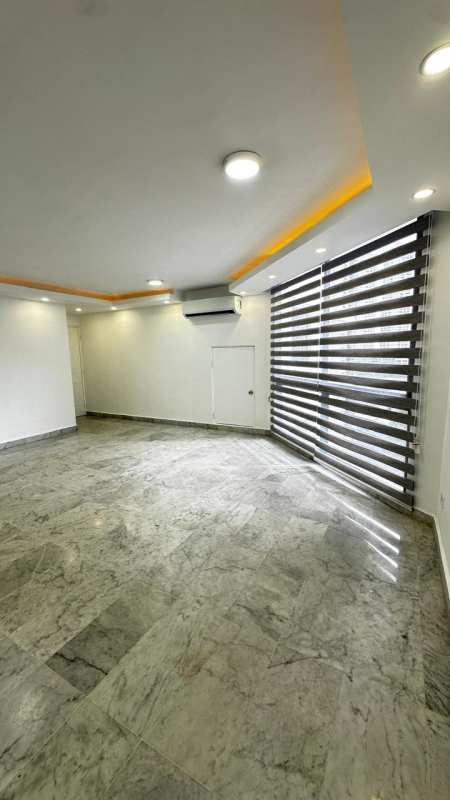 Kitchen with granite counters, cabinetry and large window in PH Villa del Mar Bella Vista Panama