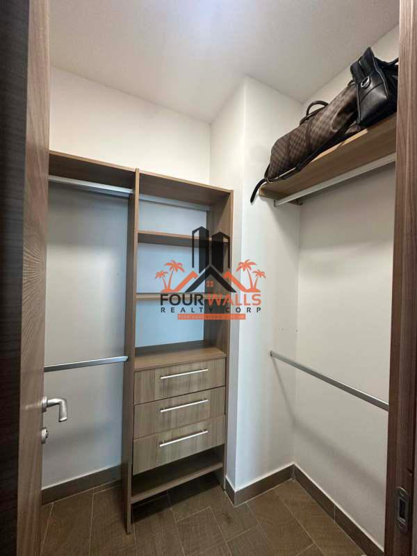 Rooftop terrace infinity pool overlooking Panama skyline and Pacific Ocean at PH Dynasty Residences