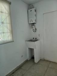 Functional laundry area with sink and water heater in PH Napa Village Playa Blanca beach villa