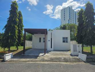 White minimalist beach villa with pergola driveway in PH Napa Village Playa Blanca Panama