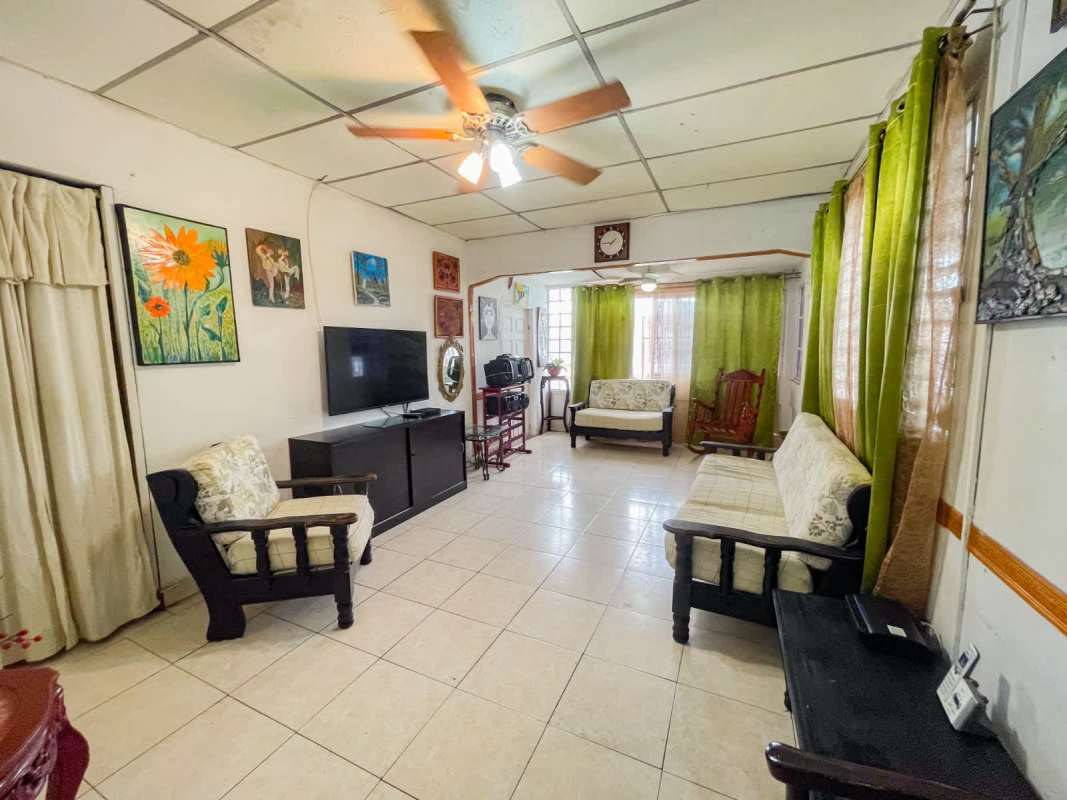 Spacious tiled living room in affordable Panama house for sale San Miguelito