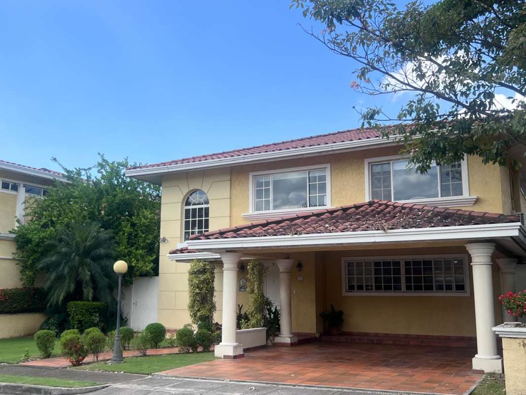 Kitchen with granite counters, white cabinets, stainless appliances Costa Dorada house in Costa del Este Panama