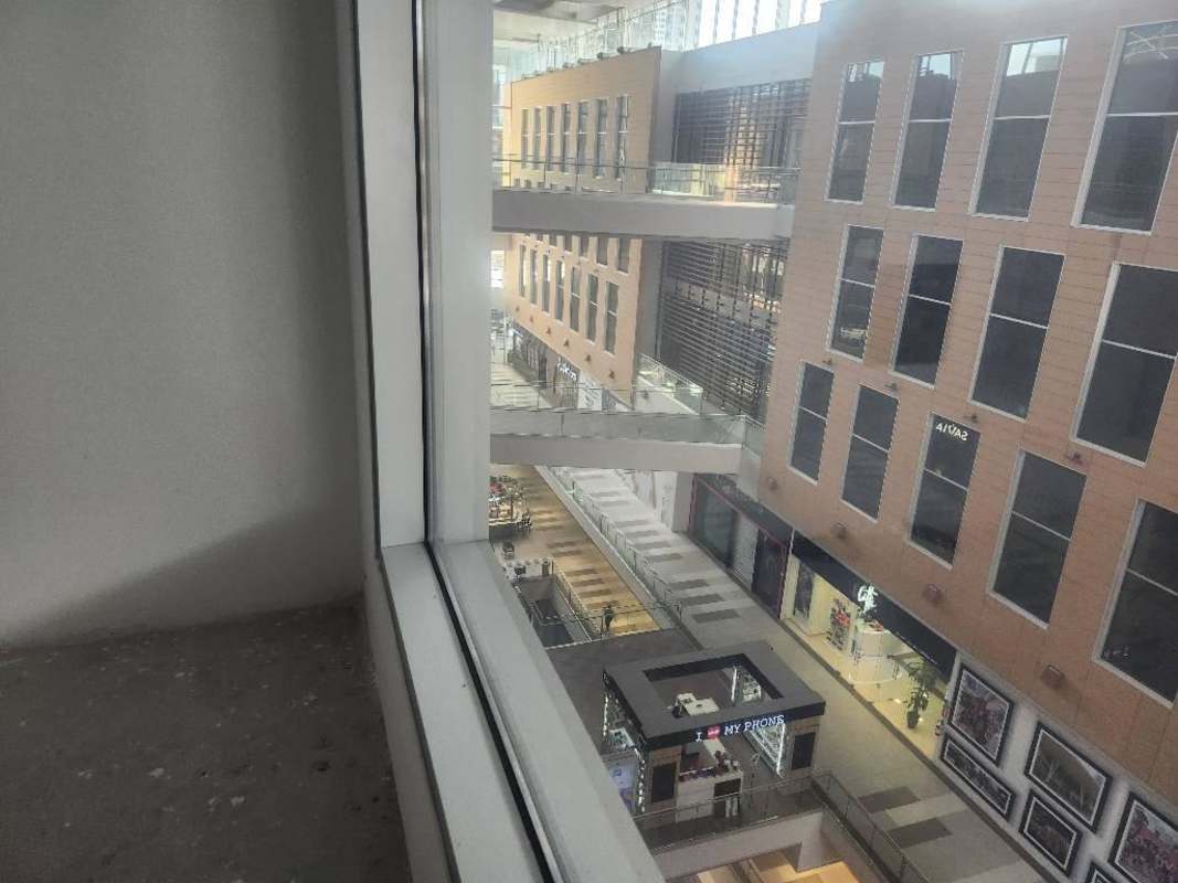 Unfinished commercial interior with white walls and concrete floor in TownCenter Costa del Este