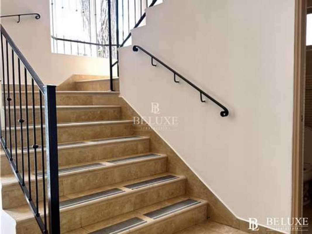 Bedroom with large window, built-in closet, air conditioning and security bars at PH Embassy Garden Clayton Panama house for rent