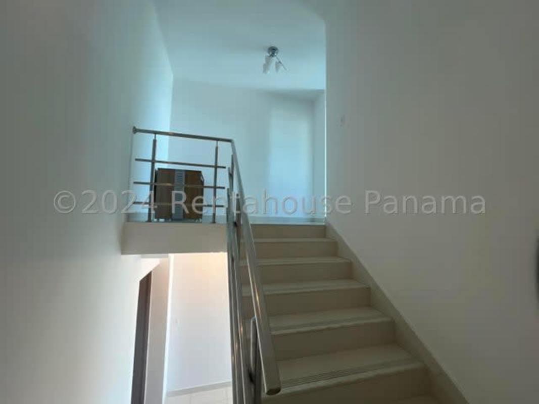 Bedroom with large windows and panoramic view in PH Park Loft Panama