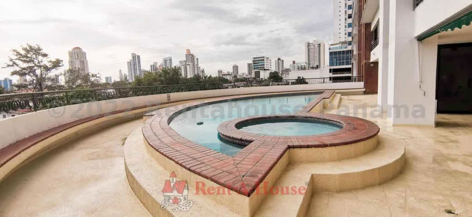 Curved outdoor pool and hot tub terrace overlooking Panama City skyline in PH San Francisco
