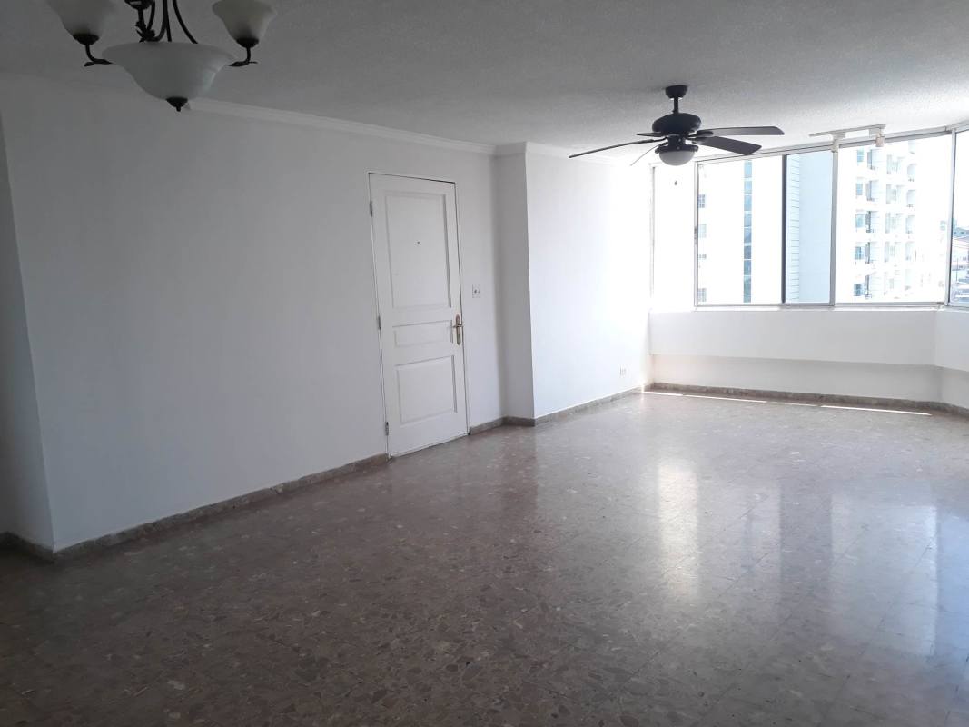 Bright empty living room with marble tiles, ceiling fan, natural light, in PH El Dorado Panama