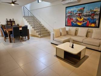 Open-concept living and dining tiled floors staircase home for sale Panama Pacifico